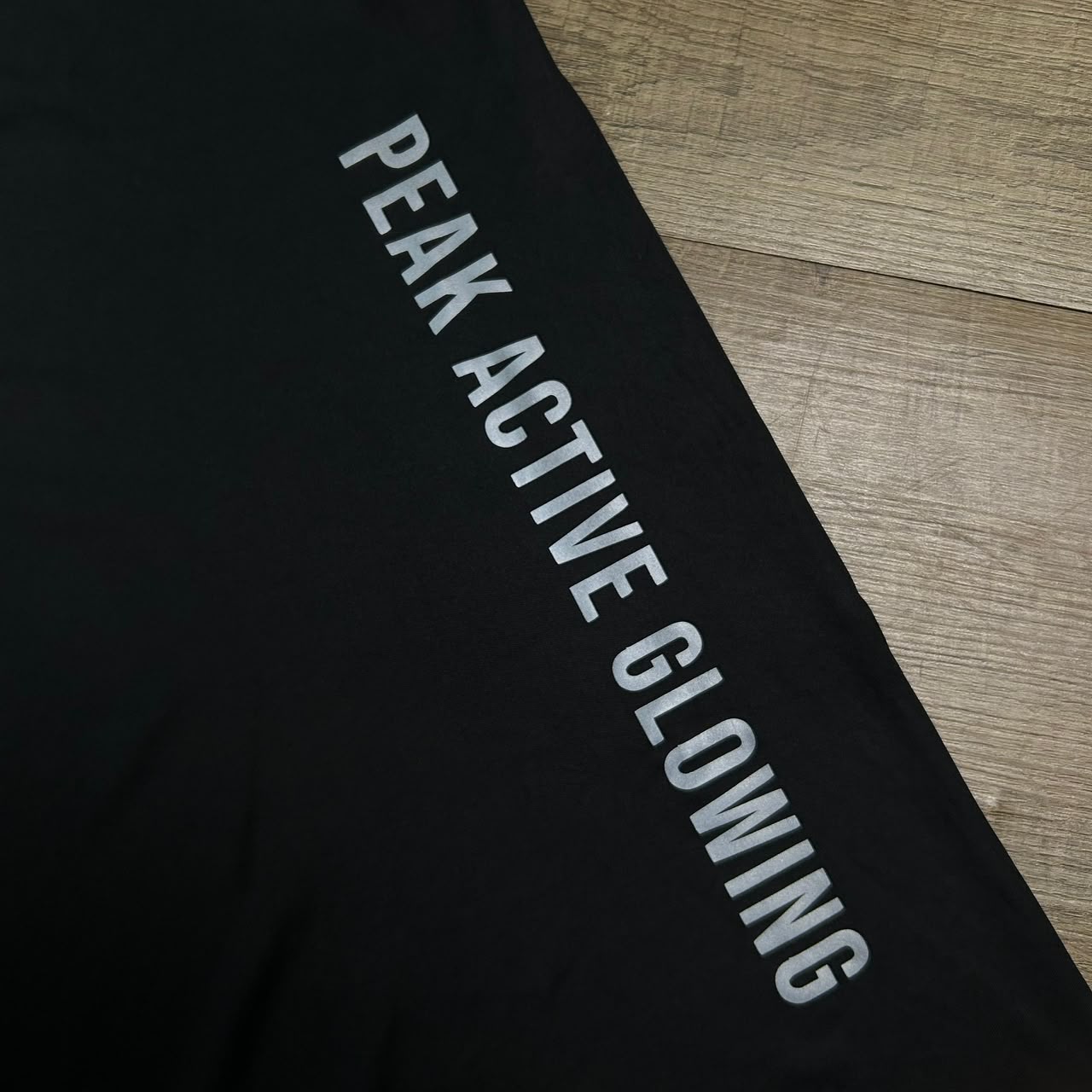 Reflective PEAK ACTIVE GLOWING print on the tee